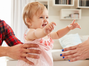 Toddler taking her first steps
