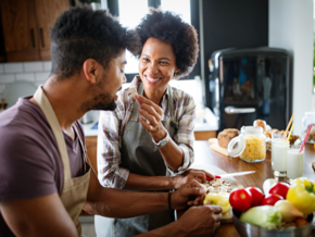 woman and man eating in the kitchen